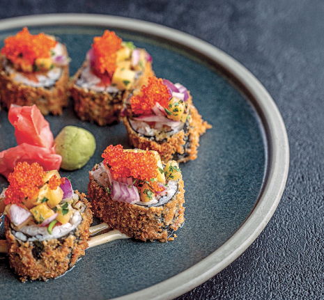 Fresh-made sushi roll with tuna, smoked salmon, avocado, flash-fried nori, fruit salsa, and tobiko at Rusted Rake Brewing